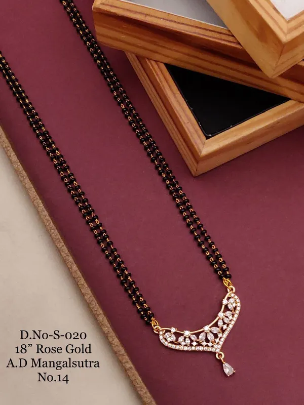 https://d1311wbk6unapo.cloudfront.net/NushopCatalogue/tr:f-webp,w-600,fo-auto/D-NO-S-020 ROSE GOLD AD 18 FANCY MANGALSUTRA_1684936623079_hqqr00ztgv6nndg.jpg__Ketmera